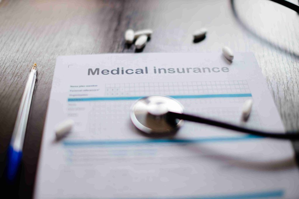 picture of medical insurance with tablets and stethoscope
