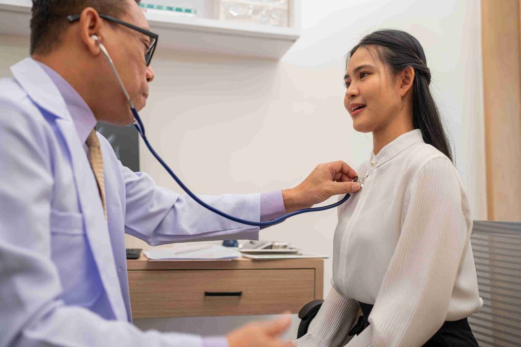 doctor examining a female patient