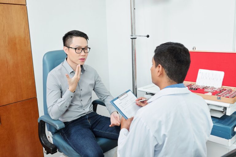 Doctor talking with a male patient