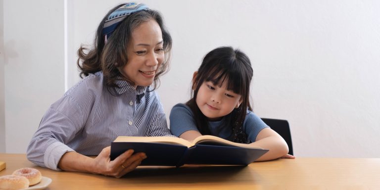 mother reading a book with her child