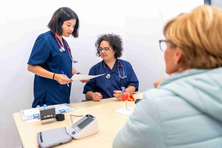 nurse and doctor looking at paperwork