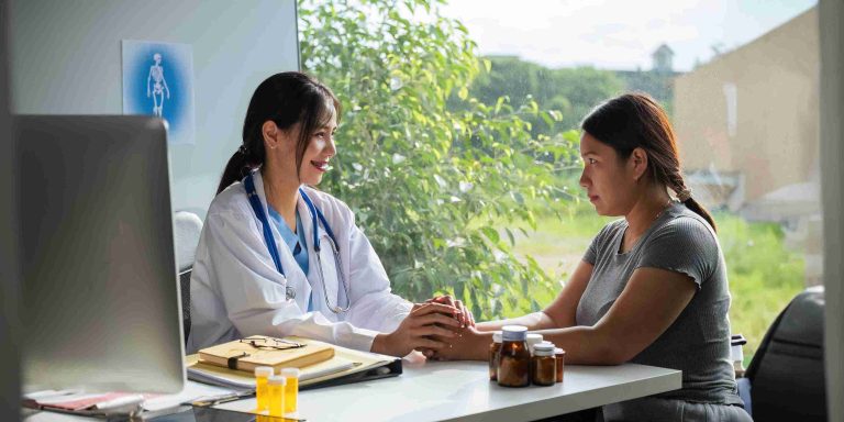 female doctor speaking with a patient