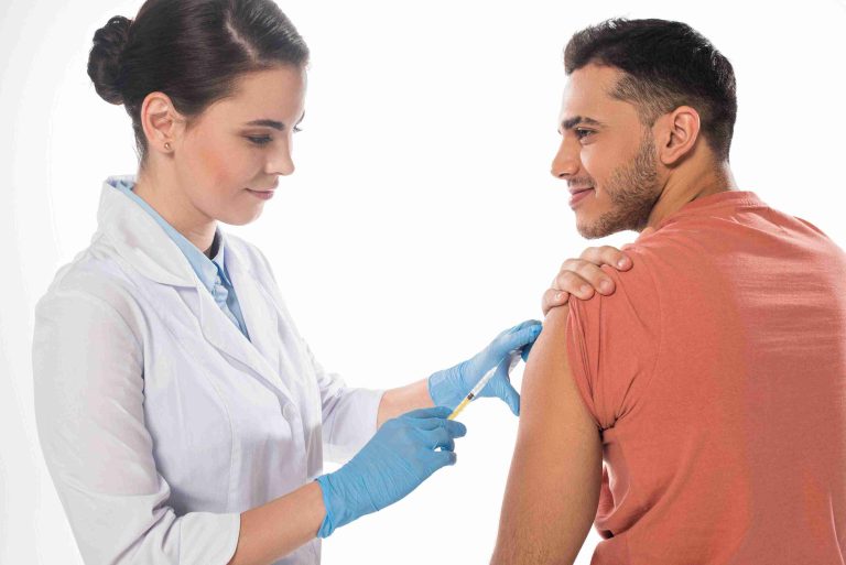 female doctor giving a male patient the flu shot