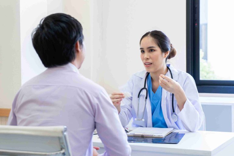 Female doctor speaking with a patient.