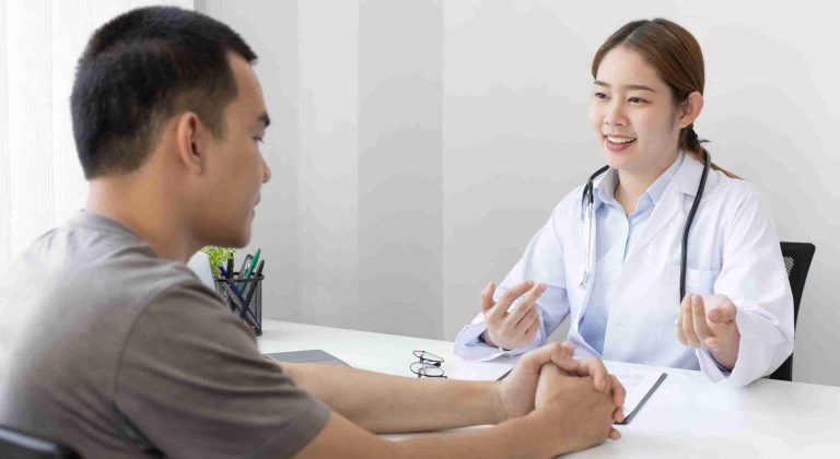 Female doctor speaking with a patient.