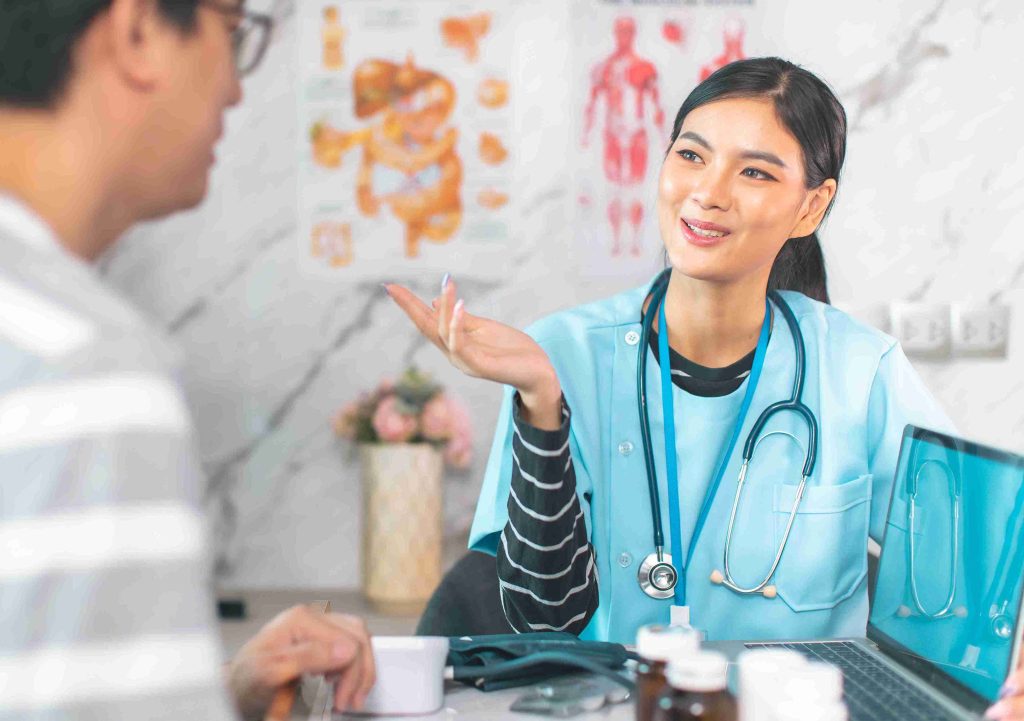 Young female doctor speaking with her patient.