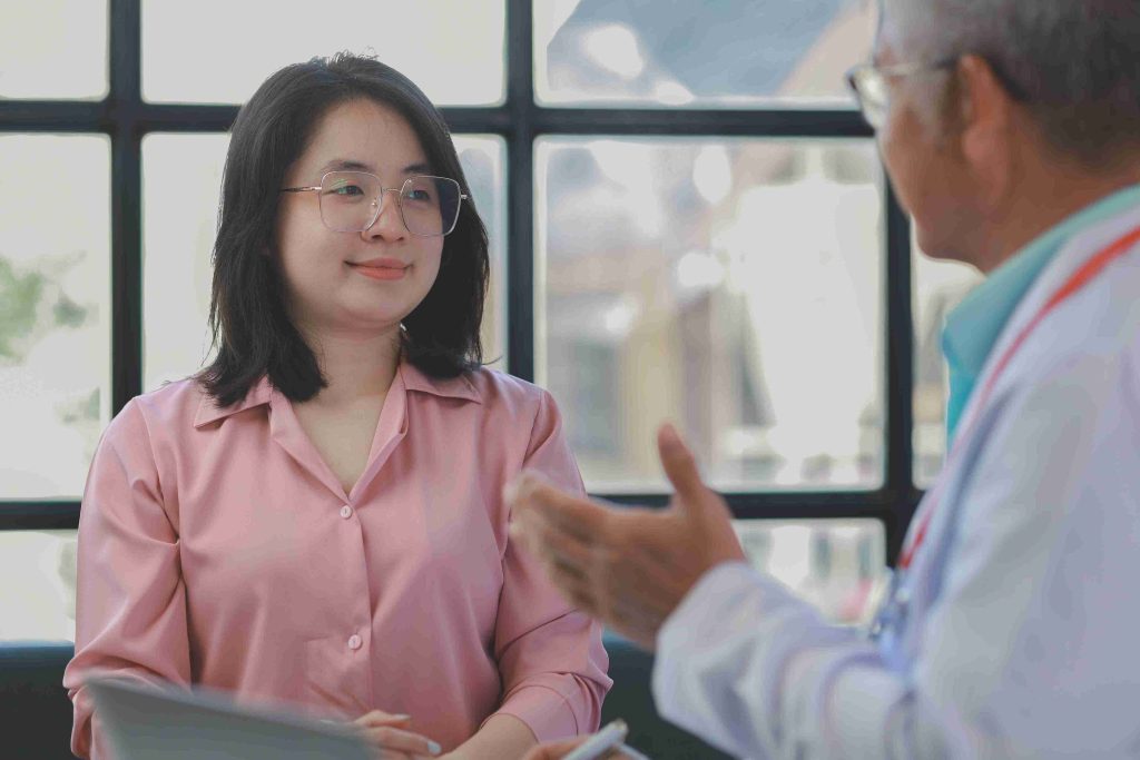 Female patient speaking with her doctor.