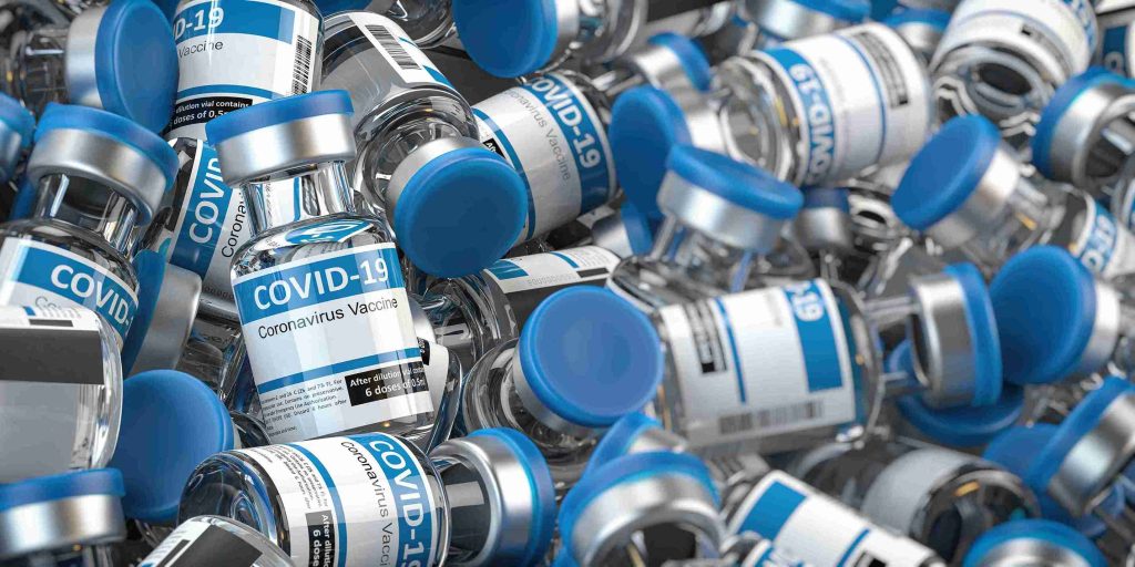 Pile of COVID-19 vaccine vials.