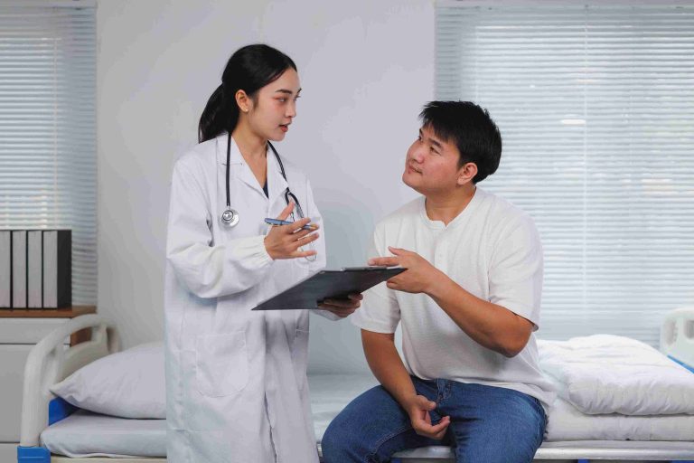 Healthcare worker speaking with a patient.